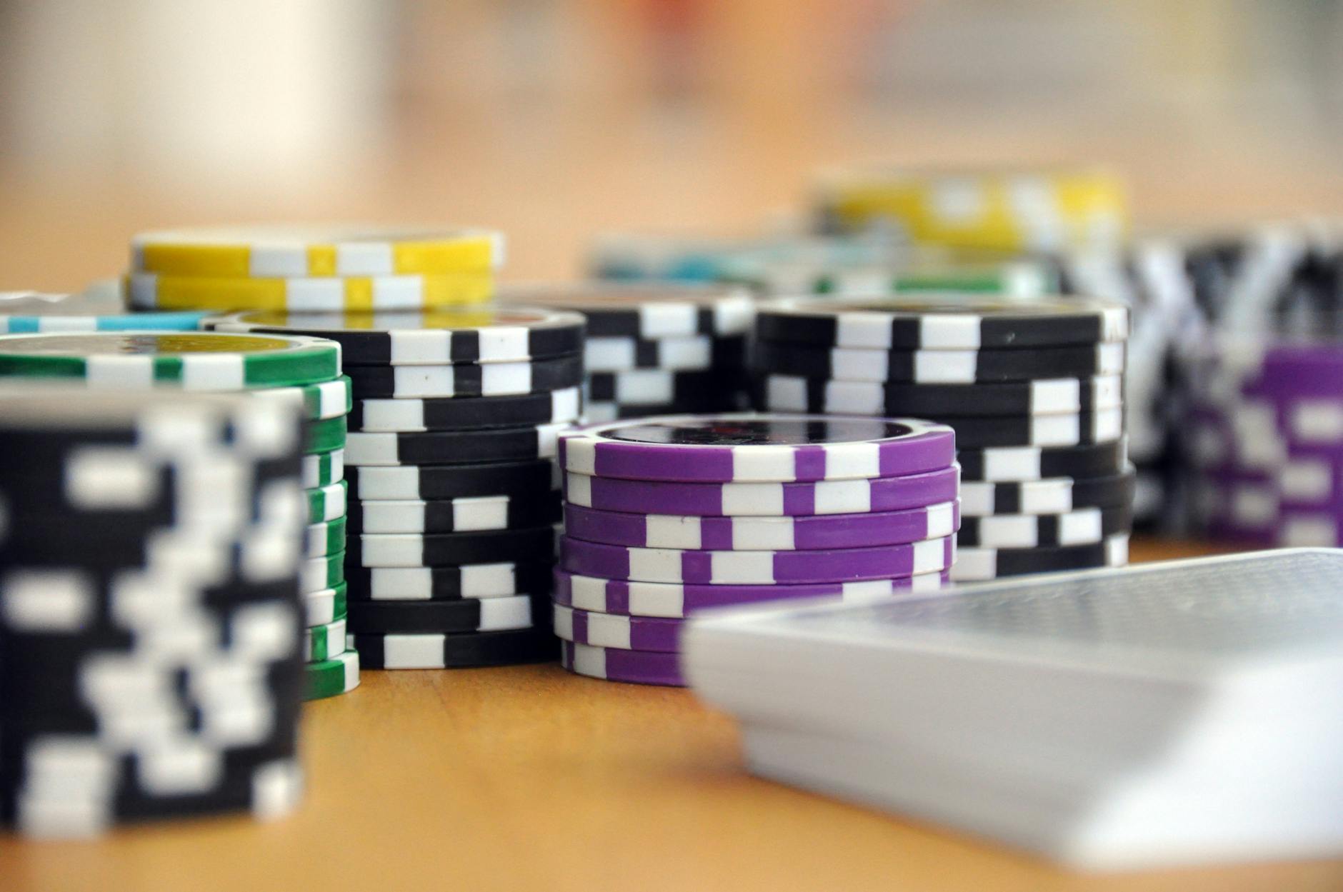 Poker chips and playing cards on casino table